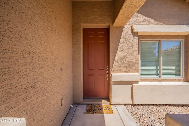 1956 N Hubbard Ln, Casa Grande, AZ 85122 - doorway to property featuring stucco siding