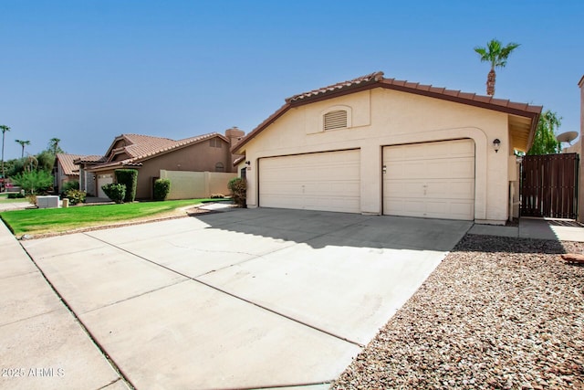 mediterranean / spanish house with a garage