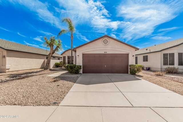 ranch-style home with a garage