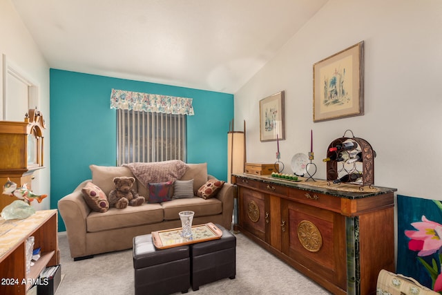 carpeted living room featuring lofted ceiling