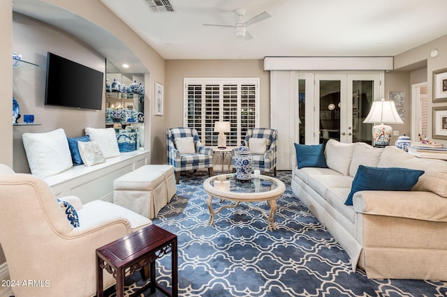 living room featuring ceiling fan and carpet flooring