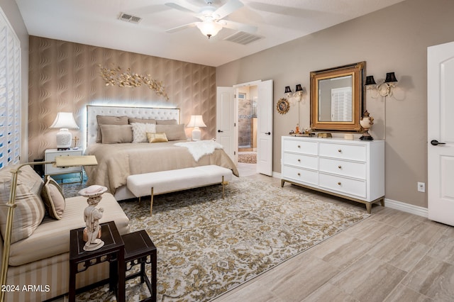 bedroom featuring connected bathroom and ceiling fan