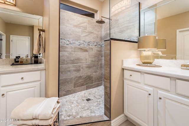 bathroom featuring vanity and a tile shower