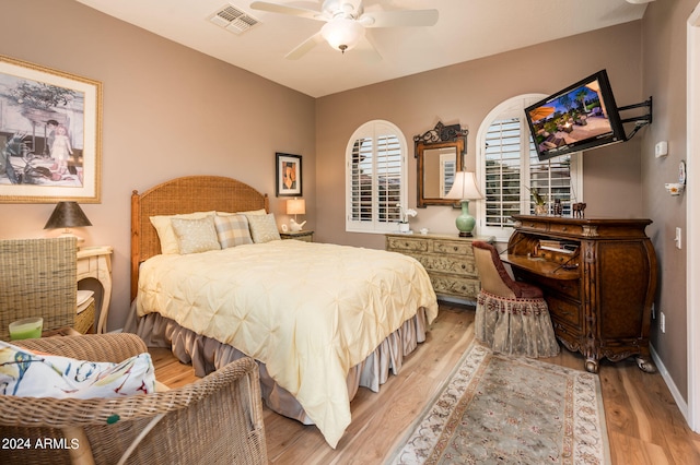 bedroom featuring light hardwood / wood-style floors and ceiling fan