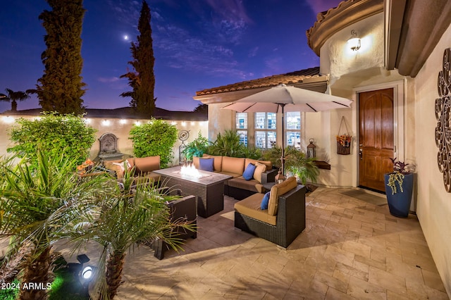 patio terrace at dusk with outdoor lounge area