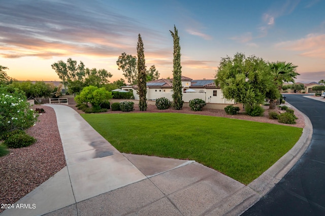 view of front of home with a lawn