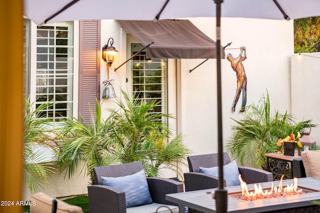 view of patio with an outdoor fire pit