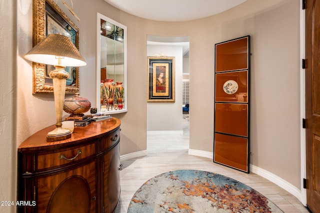 corridor with light hardwood / wood-style flooring