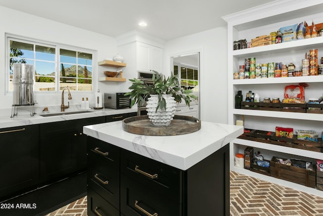 kitchen featuring a kitchen island and sink