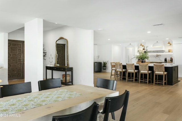 dining area with light wood-type flooring