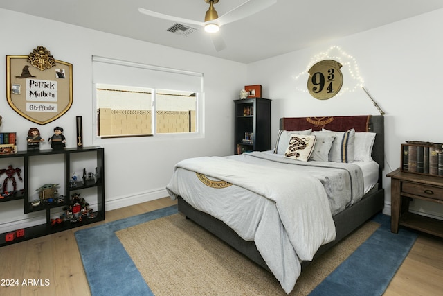 bedroom with hardwood / wood-style flooring and ceiling fan