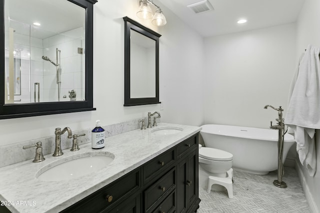 full bathroom with tile patterned flooring, vanity, shower with separate bathtub, and toilet