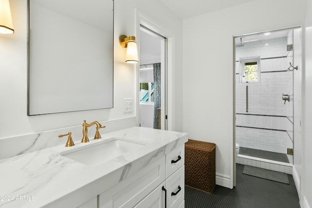 bathroom featuring vanity, an enclosed shower, and toilet