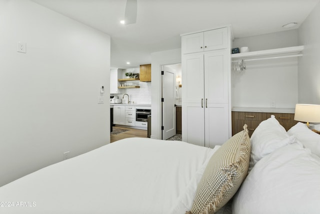 bedroom featuring sink and a closet