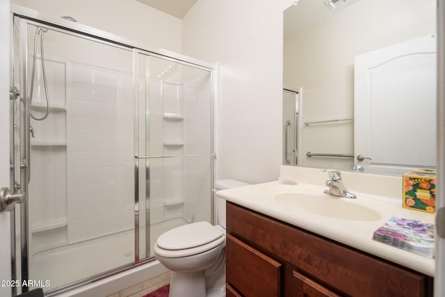 bathroom with vanity, toilet, and an enclosed shower