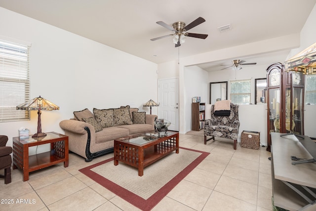 tiled living room with ceiling fan