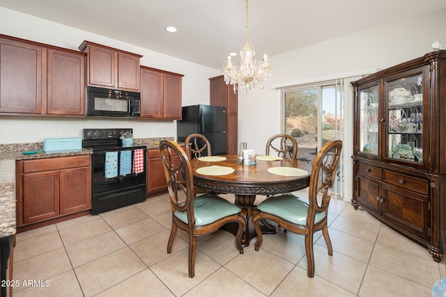 dining space with light tile patterned floors and an inviting chandelier