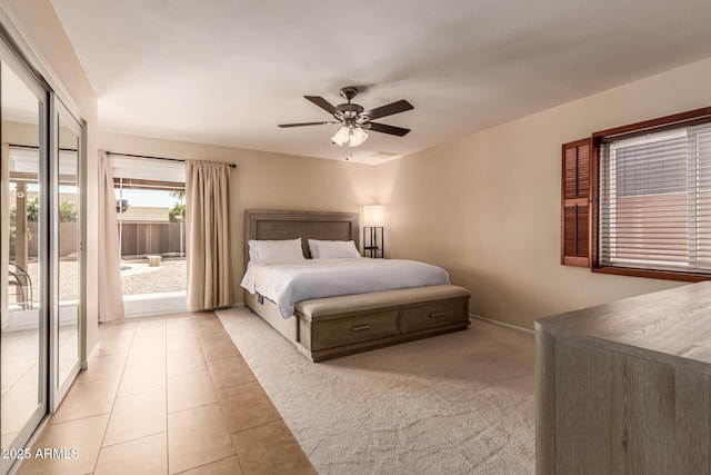 4245 E Yawepe St, Phoenix, AZ 85044 - bedroom with light tile patterned floors, a ceiling fan, and access to exterior