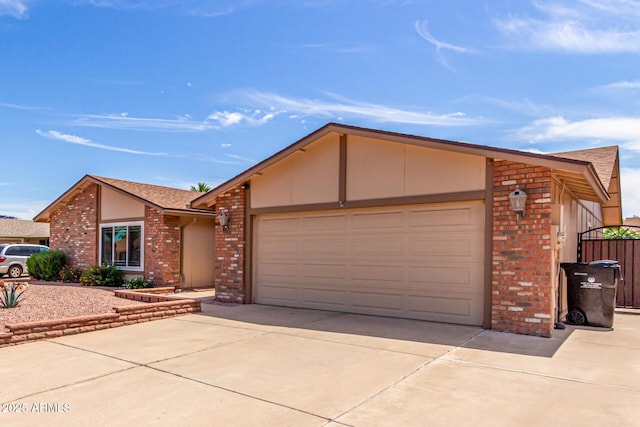 4245 E Yawepe St, Phoenix, AZ 85044 - view of front of home with driveway, a garage, and brick siding