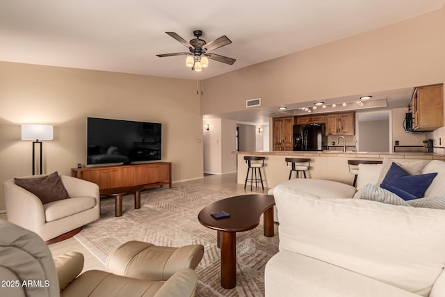 4245 E Yawepe St, Phoenix, AZ 85044 - living room featuring baseboards, visible vents, and a ceiling fan