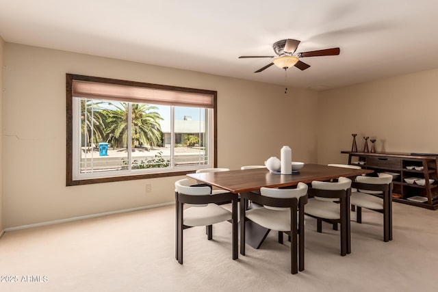 4245 E Yawepe St, Phoenix, AZ 85044 - dining room featuring baseboards, ceiling fan, and light colored carpet