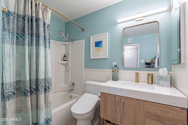 full bathroom with vanity, shower / tub combo with curtain, and toilet