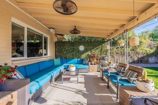 view of patio featuring ceiling fan and outdoor lounge area