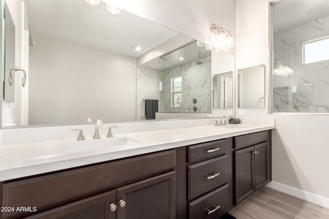 bathroom featuring vanity and a tile shower