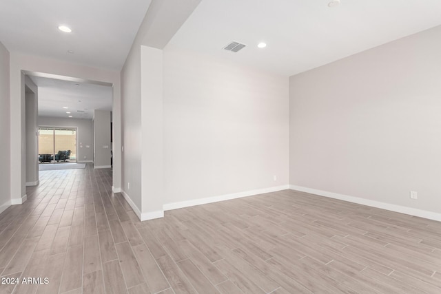 unfurnished room with light hardwood / wood-style floors