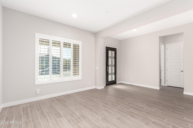 spare room featuring light hardwood / wood-style floors