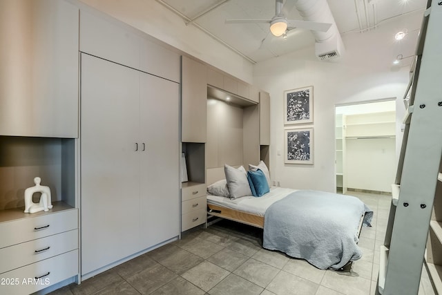 bedroom with ceiling fan and a closet