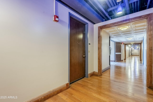 corridor featuring light hardwood / wood-style floors