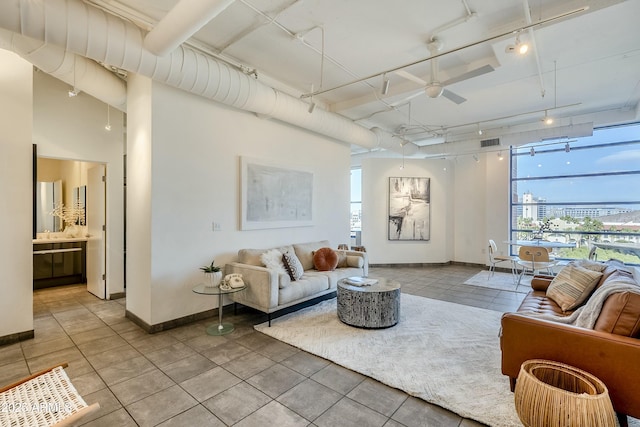 living room featuring ceiling fan and track lighting