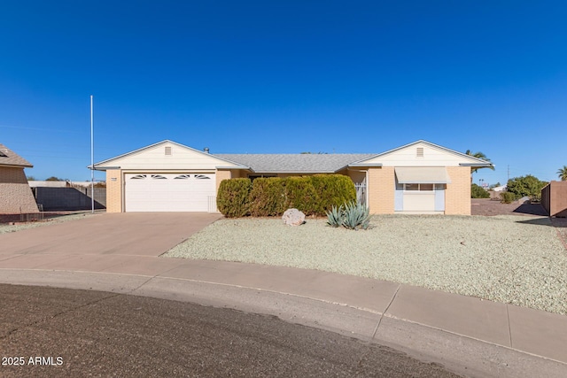 ranch-style home featuring a garage