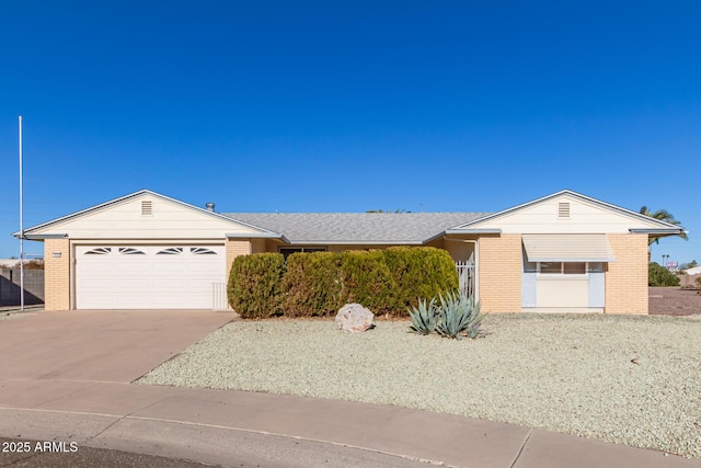 ranch-style house featuring a garage