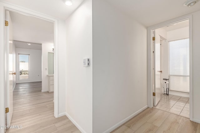 corridor featuring light hardwood / wood-style flooring