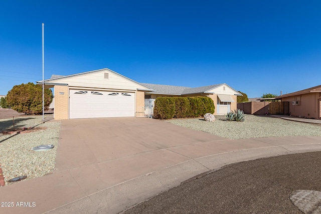 ranch-style home featuring a garage