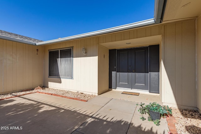 entrance to property with a patio