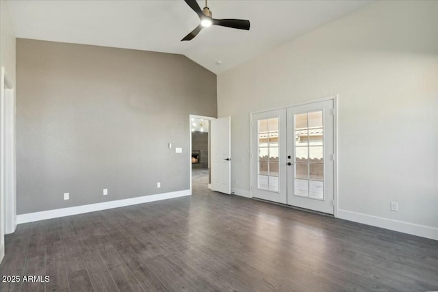 empty room featuring french doors, ceiling fan, dark hardwood / wood-style floors, and vaulted ceiling