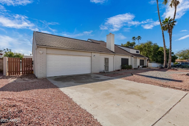 ranch-style house featuring a garage