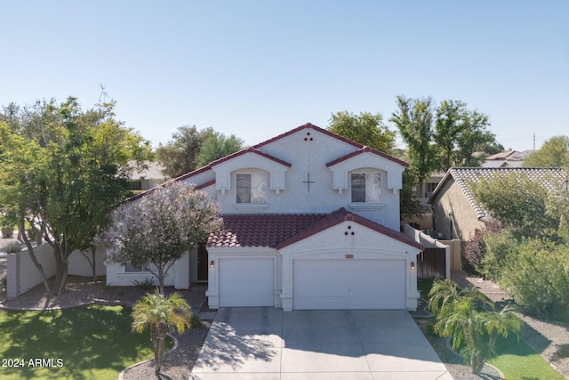 mediterranean / spanish-style house featuring a garage