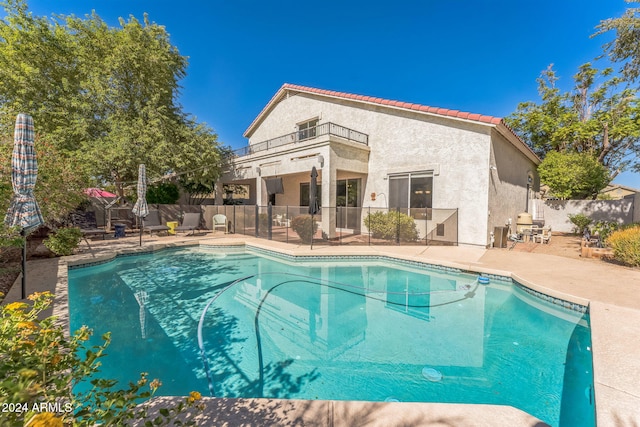 view of swimming pool with a patio area