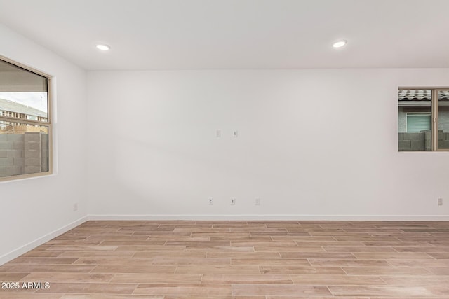 spare room featuring light hardwood / wood-style flooring