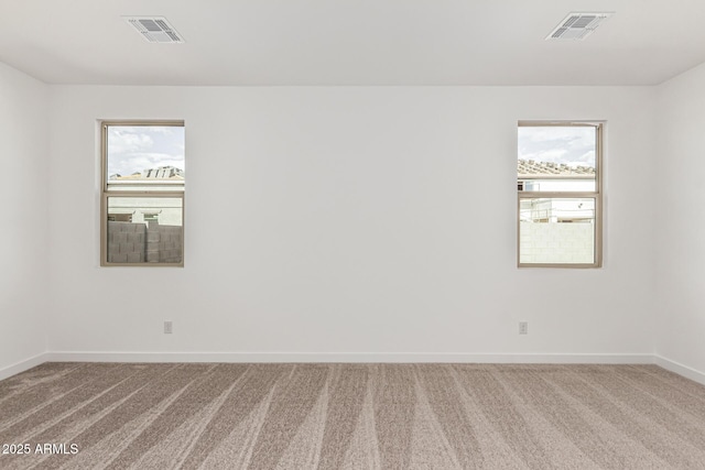 unfurnished room featuring carpet flooring