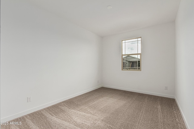 spare room with carpet floors