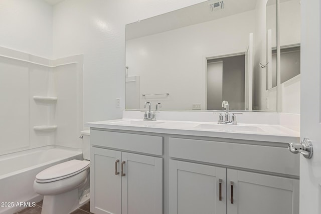 full bathroom featuring toilet,  shower combination, and vanity