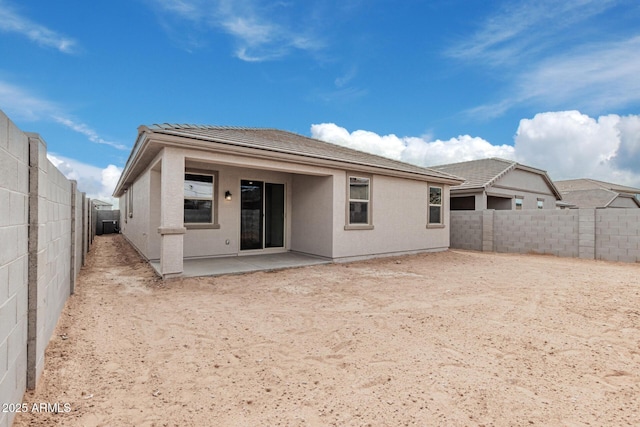 rear view of house with a patio