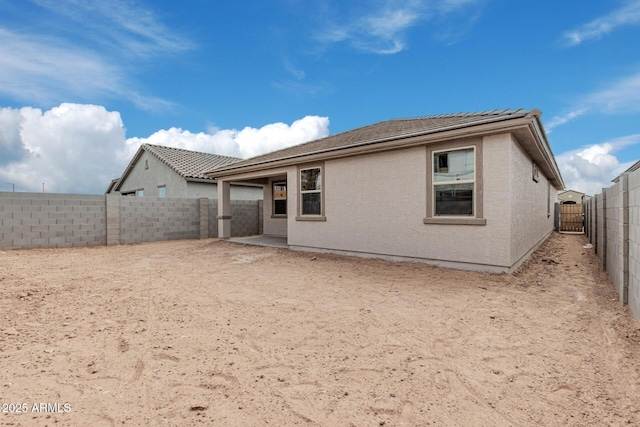 rear view of house with a patio