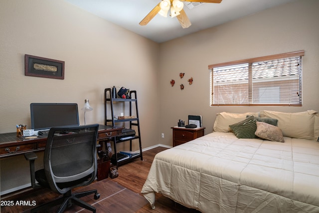 bedroom featuring dark wood-style floors, baseboards, and a ceiling fan