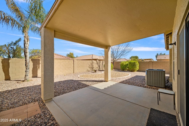 view of patio with central AC unit and a fenced backyard